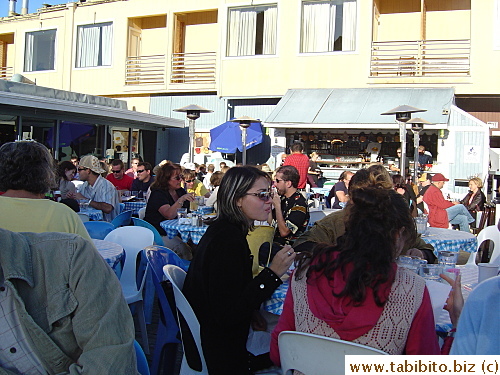 Happy diners eating outdoors at Sam's Café