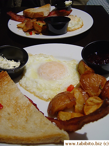 KL and I split a breakfast at SF airport after we were done checking in.  Our perceptive waiter put it on two plates without us asking  