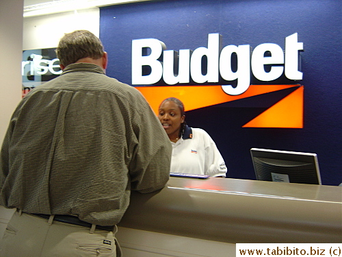 Bruce getting the final details worked out at the car rental counter in Birmingham airport