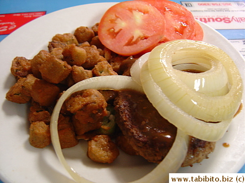 KL's hamburger steak topped with robust onion rings and fried okra