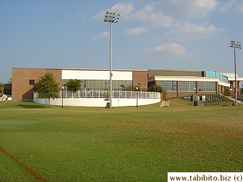 The back of the recreation center opens out to an expansive piece of lawn where many students toss a football or so