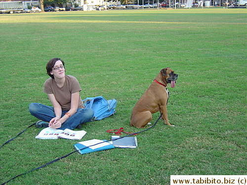 A student and her dog relaxing in the quad and she let us take their picture