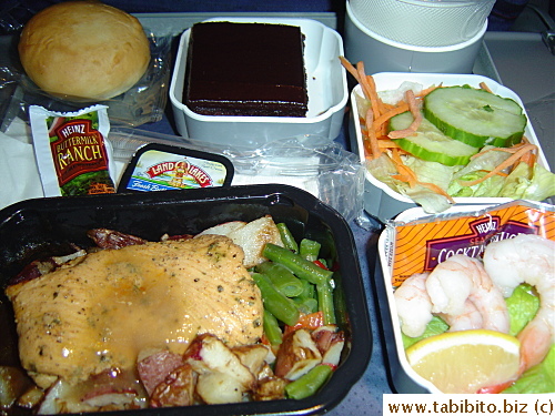 I enjoyed my dinner on the plane: Rotisserie chicken and roasted red potatoes, shrimp cocktail, garden salad with Ranch dressing and chococlate cake