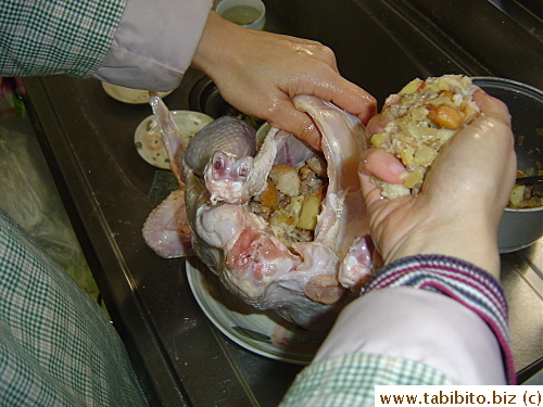 Putting stuffing into the turkey