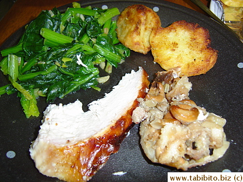 Our Christmas dinner: Spinach with garlic and olive oil, crunchy roasted potatoes, turkey and stuffing