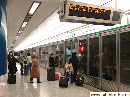Passengers at the airport express train track