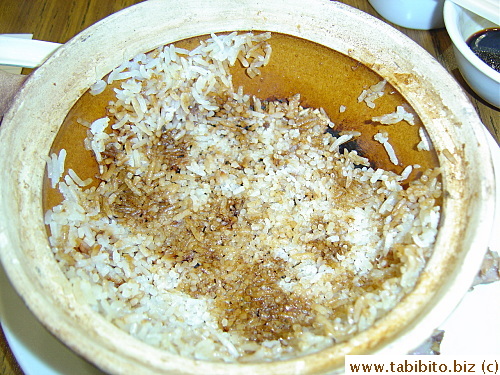 The problem with the clay pot rice is you can never get to the bottom of it.  The crust on the bottom is too hard and too burnt to be edible