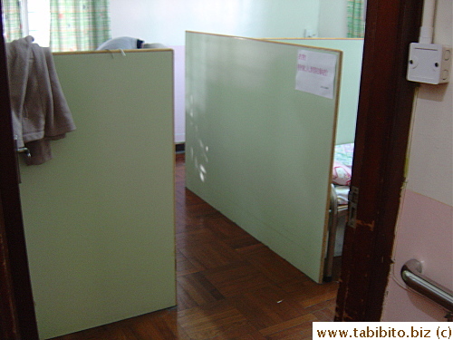 This particular room inside the nursing home has beds sectioned off by panels to ensure privacy