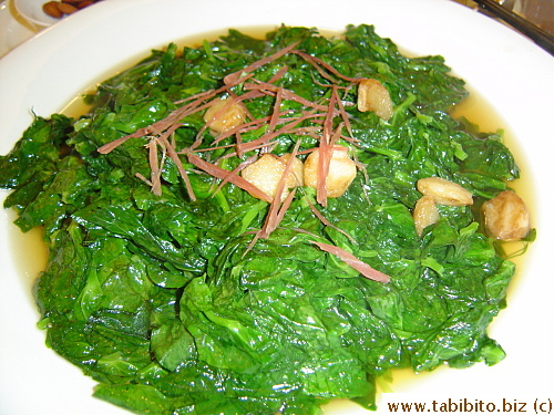 Very tasty pea shoots cooked in chicken stock