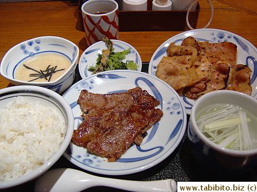My delicious lunch set: beef and spicy pork, pickled vegetables, tail soup, rice and the horrible slimy yam (top left corner)