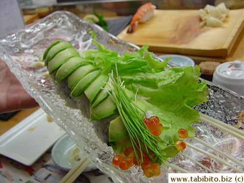 Sushi with avocado and sprouts and mayo, I had a piece which tasted quite nice