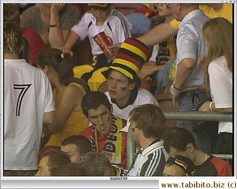 The German fan with the hat looks intense and worried at half time
