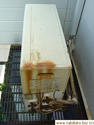 The exhaust system of the old air-con is rusty and tatty