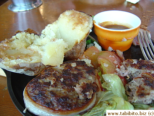 You can see the steam rising from the cut potato when you look carefully.  The potato's so incredibly fluffy and sweet