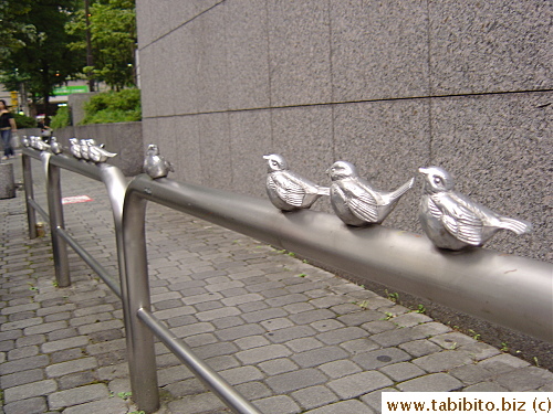 The rails on the side of the Ward Office is decorated with birds