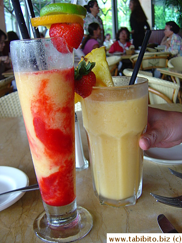 Our drinks: (Left) Frozen Iced Mango (Mango, Tropical Juices, Hint of Coconut Blended with Ice and Swirled with Raspberry Puree) $4.95 (Right) Tropical Smoothie ( Mango, Passion Fruit, Pineapple and Coconut All Blended with Ice $5.95