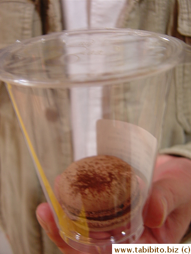 The macarons are packaged in their own instant-seal plastic cup