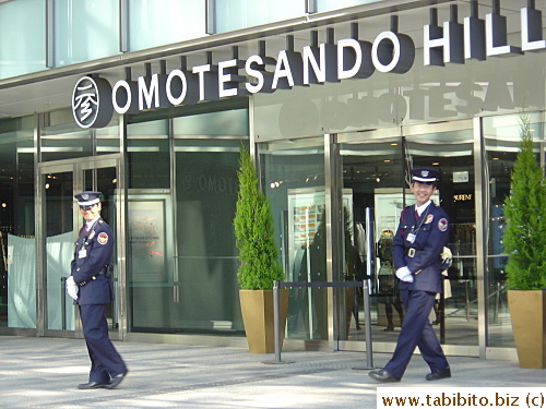 Guards outside the entrance before opening time