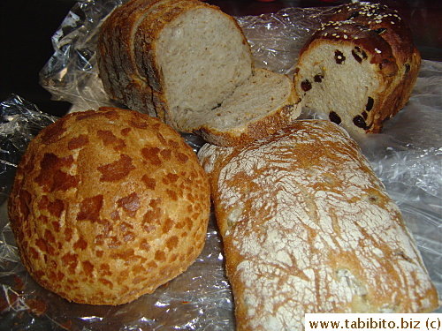 Top row, left to right: sour dough bread, cinnamon raisin bread.  Bottom row: Dutch bread, olive bread