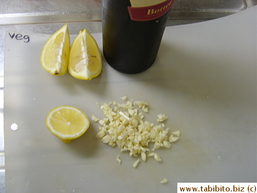 Sprinkled chopped garlic, lemon juice and red wine on them. White wine is better for this dish but I wanted to use up the leftover red wine