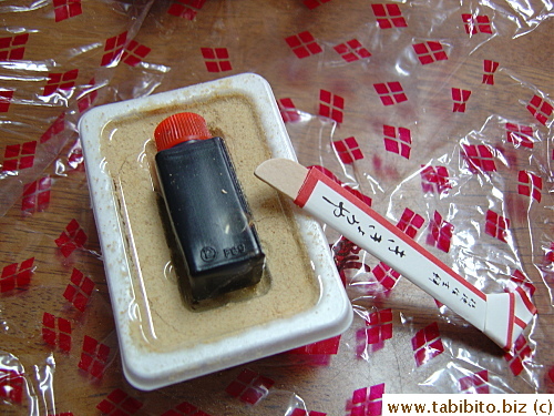 Each individual package holds the container of mochi, dark syrup and wooden utensil