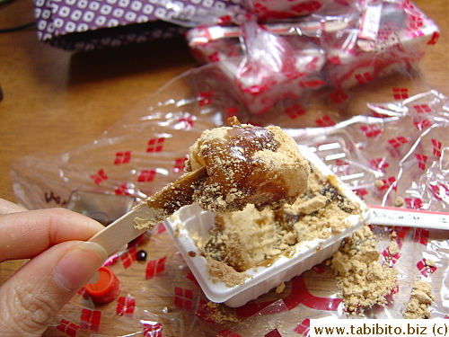 Dig up the mochi with the fat toothpick and eat