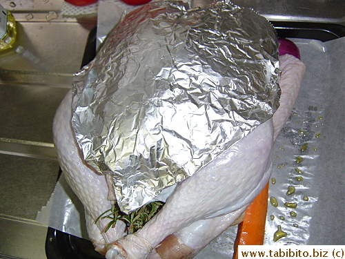 I molded a piece of foil over the breast before it went into the oven for easy application after the initial roasting, as instructed by Alton Brown