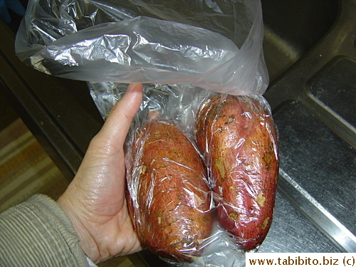 The easiest way to prep the Annouimo is to put them in a plastic bag, put 5 drops of canola oil over each, rub the oil all over them and slide them onto the roasting pan. Your hands remain grease-free the whole time. The sweet potatoes (about 240 gm each) then go to a 200C oven for 70 minutes
