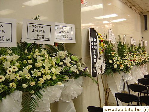 All flower arrangements have names of the senders on top