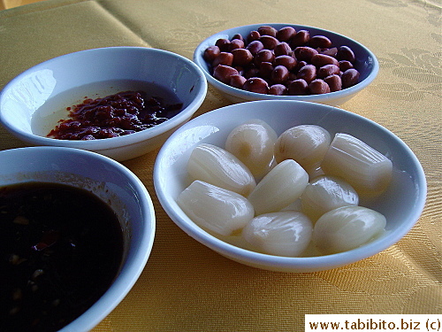 Every table was given roasted peanuts, pickled garlic and sauces whether you want them or not, and they were all charged for a fee