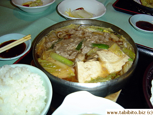 Sukiyaki closeup. I would not have ordered this myself as I think it's a bad way of cooking beef. The constant boiling renders the meat tough
