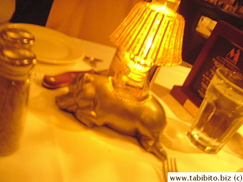 Piggy table lamps seem out of place in a steak house