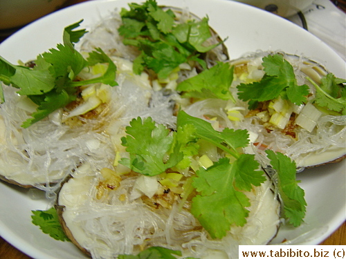 A splash of hot oil and soy and some garnish of cilantro finish off the dish.  Mmmmm