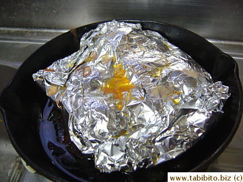 I wrapped some new potatoes in foil in the cast iron pan which was placed under the chicken to catch the drippings 