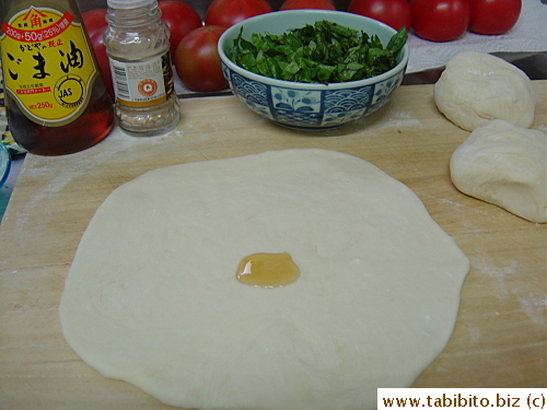 Divided dough ball rolled out into a flat round