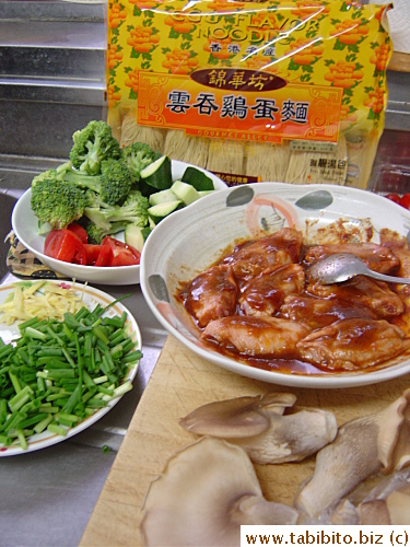 Ingredients for dinner: noodles, veggies, marinated wings