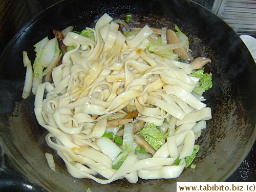 Stirfrying it Shanghai style which is stirfried thick noodles with dried shiitake, pork and cabbage (I used Chinese cabbage)