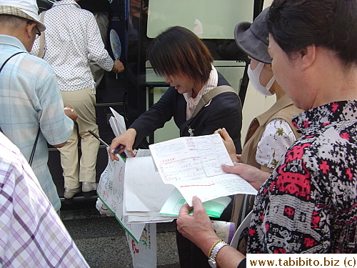 Quick registration with the tour guide before we boarded the bus