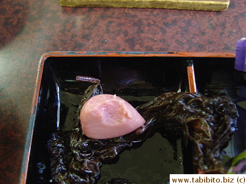The black thing on the left is a whole garlic wrapped in a purple shiso leaf.  The marinating/fermenting process rendered the garlic to taste nothing like a garlic anymore, but it tasted like a completely different element which I have no idea how to describe.  Anyway I spat it out, yep, it's that bad