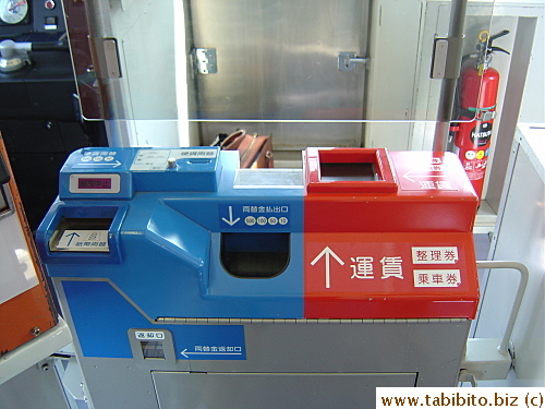 Typical ticket machine behind the driver which takes bills, coins, cards and makes changes