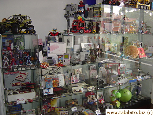 Peter's prized collection of toys and stuff.  Looks like a display case in a shop