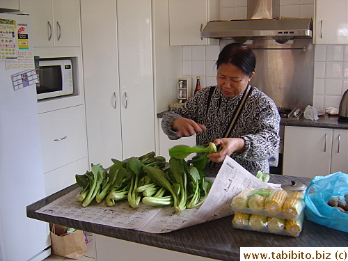 Mom sorting out vegetables she just bought