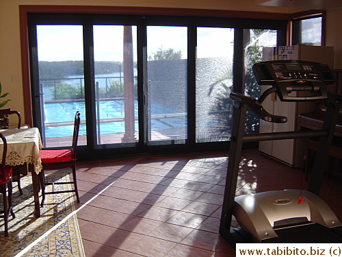 An exercise room/living room in the basement