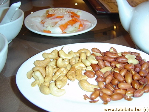 Complimentary peanuts and pickled daikon and carrots