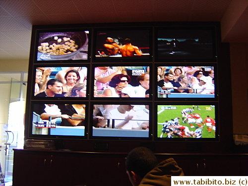 Large screen showing sports programs