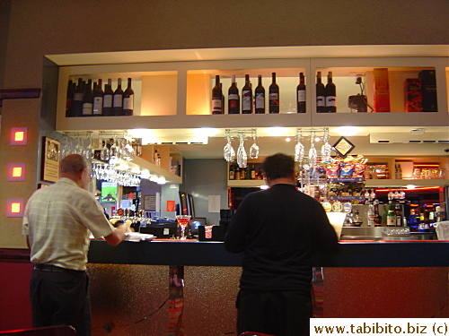 A bar shares the same dining area