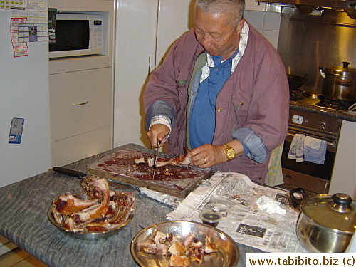 Dad chops suckling pig