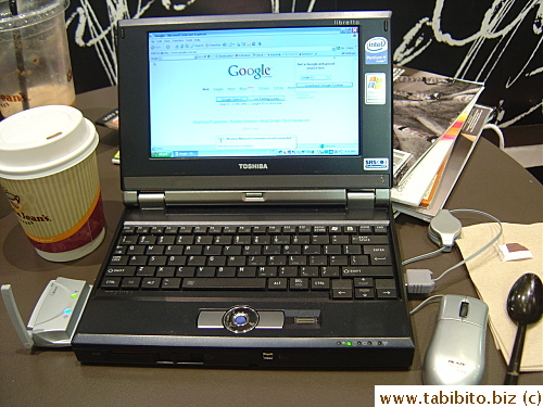 David often surfs the web on his mini laptop in Gloria Jean's while Serlina shops