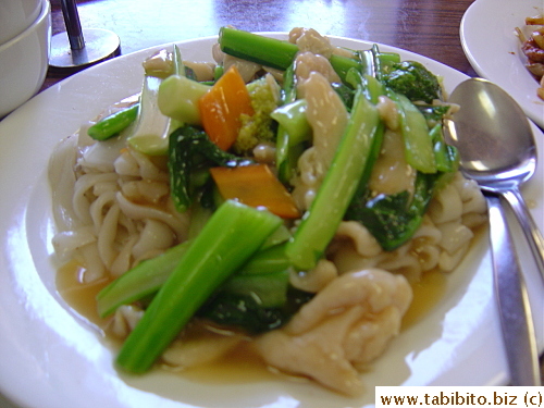 Delicious fried flat noodles with chicken