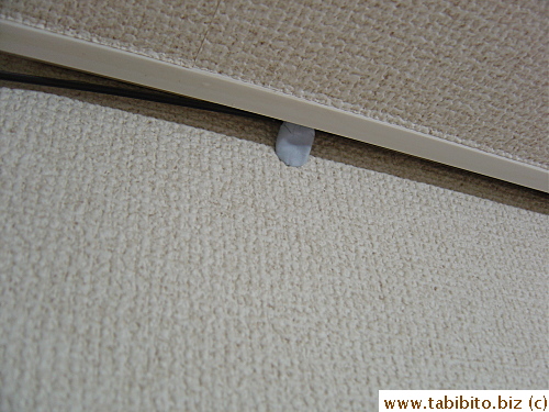 We used Bluetac to hold the cable because we can't let them drill holes on the wall to install plastic tubes (5 bucks for a meter) to house it.  Saves us money this way too
